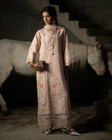 Woman in a traditional outfit standing in front of a horse with a dark background